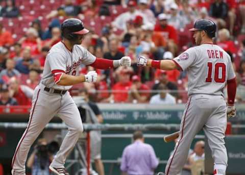 Jun 4, 2016; Cincinnati, OH, USA; Washington Nationals shortstop Danny Espinosa (8) is congratulated by pinch hitter Stephen Drew (10) after Espinosa hit a solo home run against the Cincinnati Reds during the eighth inning at Great American Ball Park. Mandatory Credit: David Kohl-USA TODAY Sports