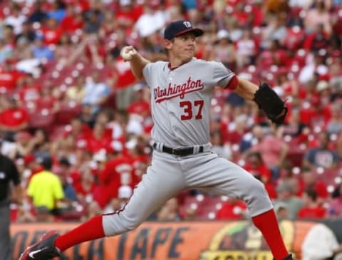 Jun 4, 2016; Cincinnati, OH, USA; Washington Nationals starting pitcher Stephen Strasburg looks to throw a pitch for his 1000th career strike out against the Cincinnati Reds during the fifth inning at Great American Ball Park. Mandatory Credit: David Kohl-USA TODAY Sports