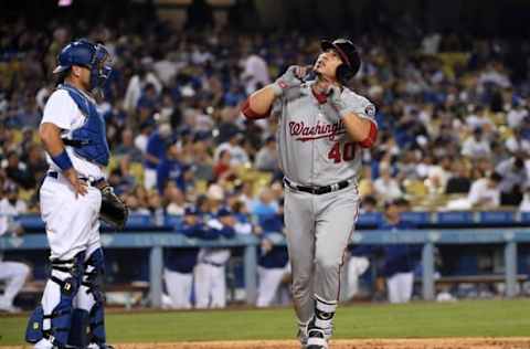 Jun 22, 2016; Los Angeles, CA, USA; Washington Nationals catcher Wilson Ramos (40) celebrates after hitting a solo home run in the eighth inning as Los Angeles Dodgers catcher A.J. Ellis (17) reacts during a MLB game at Dodger Stadium. Mandatory Credit: Kirby Lee-USA TODAY Sports