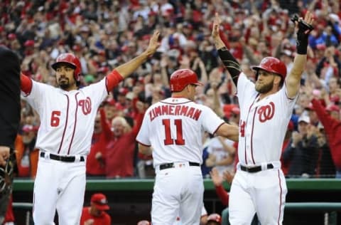 Apr 7, 2016; Washington, DC, USA; Washington Nationals second baseman Anthony Rendon (6) and right fielder Bryce Harper (34) celebrate after scoring against the Miami Marlins during the first inning at Nationals Park. Mandatory Credit: Brad Mills-USA TODAY Sports