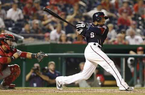 Jul 1, 2016; Washington, DC, USA; Washington Nationals center fielder Ben Revere (9) hits a game wining double against the Cincinnati Reds in the fourteenth inning at Nationals Park. The Nationals won 3-2 in fourteen innings. Mandatory Credit: Geoff Burke-USA TODAY Sports