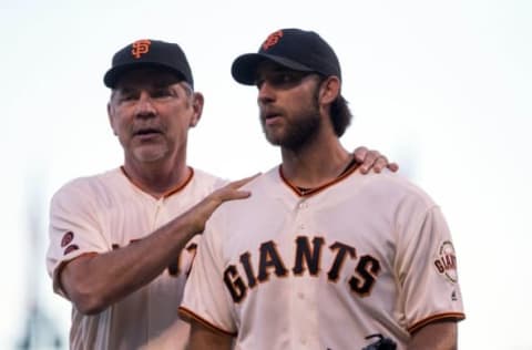 Jul 10, 2016; San Francisco, CA, USA; San Francisco Giants manager Bruce Bochy (15) celebrates with starting pitcher Madison Bumgarner (40) on the chest after his one hit shut out complete game against the Arizona Diamondbacks at AT&T Park. The San Francisco Giants defeated the Arizona Diamondbacks 4-0. Mandatory Credit: Kelley L Cox-USA TODAY Sports