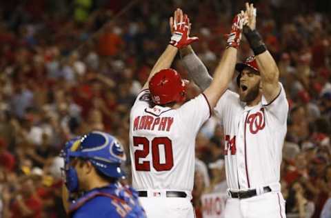 Jun 29, 2016; Washington, DC, USA; Washington Nationals second baseman Daniel Murphy (20) celebrates with right fielder Bryce Harper (34) after hitting a two-run home run against the New York Mets in the eighth inning at Nationals Park. The Nationals won 4-2. Mandatory Credit: Geoff Burke-USA TODAY Sports