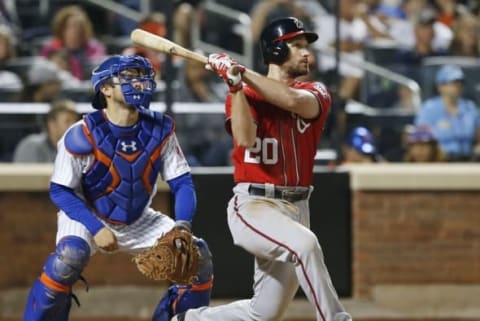 Jul 9, 2016; New York City, NY, USA; Washington Nationals second baseman Daniel Murphy (20) hits a home run in the seventh inning against the New York Mets at Citi Field. Mandatory Credit: Noah K. Murray-USA TODAY Sports