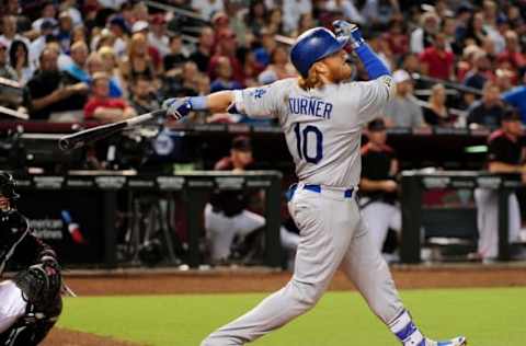 Jul 16, 2016; Phoenix, AZ, USA; Los Angeles Dodgers third baseman Justin Turner (10) hits an RBI single in the third inning against the Arizona Diamondbacks at Chase Field. Mandatory Credit: Matt Kartozian-USA TODAY Sports