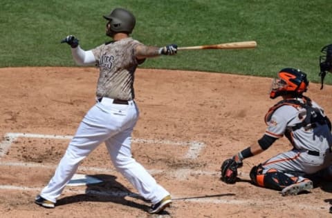 Jul 17, 2016; San Diego, CA, USA; San Diego Padres right fielder Matt Kemp (27) hits a solo home run during the fourth inning against the San Francisco Giants at Petco Park. Mandatory Credit: Jake Roth-USA TODAY Sports