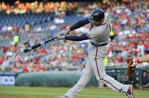 Aug 12, 2016; Washington, DC, USA; Atlanta Braves first baseman Freddie Freeman (5) hits an RBI double against the Washington Nationals during the first inning at Nationals Park. Mandatory Credit: Brad Mills-USA TODAY Sports