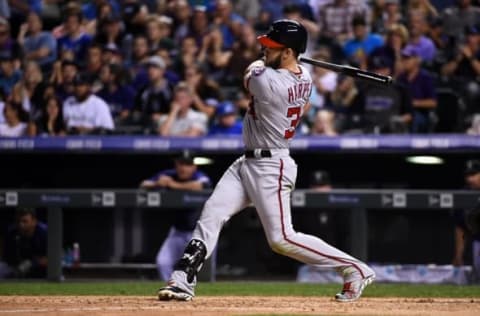 Aug 15, 2016; Denver, CO, USA; Washington Nationals right fielder Bryce Harper (34) hits an RBI double and the go ahead run in the seventh inning against the Colorado Rockies at Coors Field. The Nationals defeated the Rockies 5-4. Mandatory Credit: Ron Chenoy-USA TODAY Sports