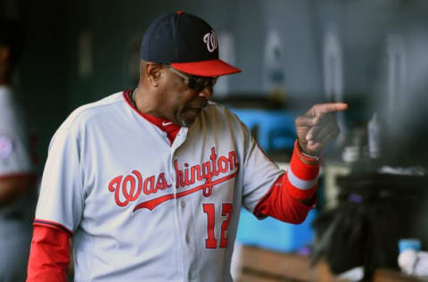 Aug 17, 2016; Denver, CO, USA; Washington Nationals manager Dusty Baker (12) calls out towards a player in his dugout in the ninth inning against the Colorado Rockies at Coors Field. The Rockies defeated the Nationals 12-10. Mandatory Credit: Ron Chenoy-USA TODAY Sports