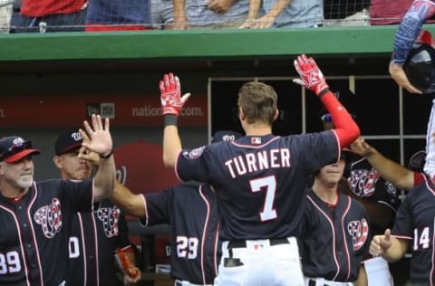 Sep 5, 2016; Washington, DC, USA; Washington Nationals second baseman Trea Turner (7) is congratulated by teammates after hitting a two run homer against the Atlanta Braves during the third inning at Nationals Park. Mandatory Credit: Brad Mills-USA TODAY Sports