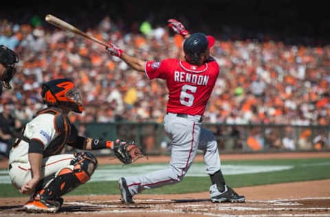 Oct 6, 2014; San Francisco, CA, USA; Washington Nationals third baseman Anthony Rendon (6) bats in front of San Francisco Giants catcher Buster Posey (28) during game three of the 2014 NLDS baseball playoff game at AT&T Park. Mandatory Credit: Kyle Terada-USA TODAY Sports