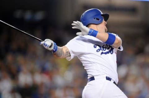 June 21, 2016; Los Angeles, CA, USA; Los Angeles Dodgers catcher Yasmani Grandal (9) hits a three run home run in the eighth inning against the Washington Nationals at Dodger Stadium. Mandatory Credit: Gary A. Vasquez-USA TODAY Sports