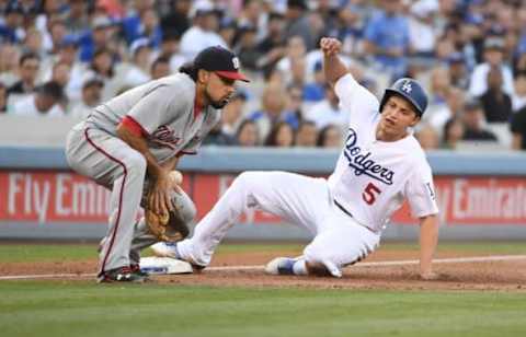 Jun 22, 2016; Los Angeles, CA, USA; Los Angeles Dodgers shortstop Corey Seager (5) slides into third base to beat a throw to Washington Nationals third baseman Anthony Rendon (6) in the first inning at Dodger Stadium. Mandatory Credit: Kirby Lee-USA TODAY Sports