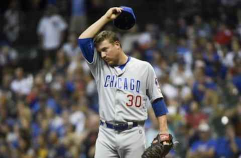 Sep 7, 2016; Milwaukee, WI, USA; Chicago Cubs pitcher Joe Smith (30) reacts after giving up a home run to Milwaukee Brewers third baseman Jonathan Villar (not pictured) in the eighth inning at Miller Park. Mandatory Credit: Benny Sieu-USA TODAY Sports