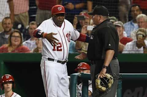 Sep 13, 2016; Washington, DC, USA; Washington Nationals manager Dusty Baker (12) argues with home plate umpire Hunter Wendelstedt (21) during the eighth inning against the New York Mets at Nationals Park. New York Mets defeated Washington Nationals 4-3 in the tenth inning. Mandatory Credit: Tommy Gilligan-USA TODAY Sports