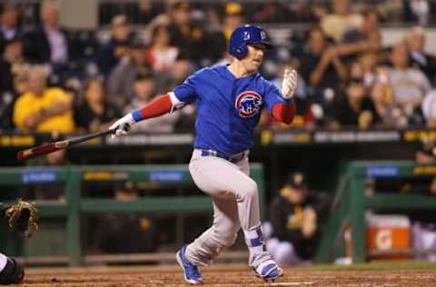 Sep 26, 2016; Pittsburgh, PA, USA; Chicago Cubs left fielder Chris Coghlan (8) singles against the Pittsburgh Pirates during the fourth inning at PNC Park. Mandatory Credit: Charles LeClaire-USA TODAY Sports