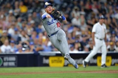 Sep 27, 2016; San Diego, CA, USA; Los Angeles Dodgers third baseman Justin Turner (10) commits a throwing error on a single by San Diego Padres center fielder Jon Jay (not pictured) at Petco Park. Jay would reach second on the error. Mandatory Credit: Jake Roth-USA TODAY Sports