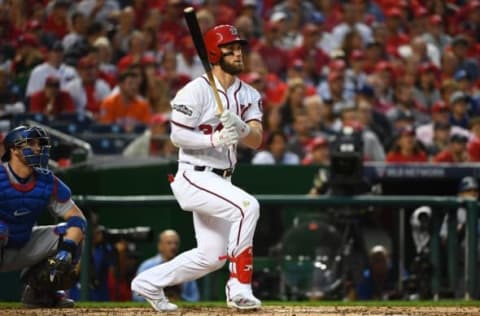 Oct 7, 2016; Washington, DC, USA; Washington Nationals right fielder Bryce Harper (34) hits a double against the Los Angeles Dodgers in the third inning during game one of the 2016 NLDS playoff baseball series at Nationals Park. Mandatory Credit: Brad Mills-USA TODAY Sports