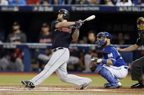 Oct 19, 2016; Toronto, Ontario, CAN; Cleveland Indians designated hitter Mike Napoli (26) hits a RBI double during the first inning against the Toronto Blue Jays in game five of the 2016 ALCS playoff baseball series at Rogers Centre. Mandatory Credit: John E. Sokolowski-USA TODAY Sports