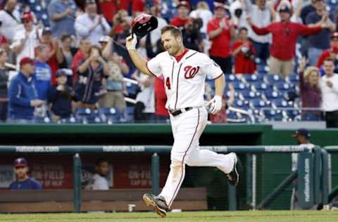 Apr 24, 2016; Washington, DC, USA; Washington Nationals center fielder Chris Heisey (14) tosses his batting helmet after hitting the game-winning walk-off home run against the Minnesota Twins in the sixthteenth inning at Nationals Park. The Nationals won 5-4 in sixteen innings. Mandatory Credit: Geoff Burke-USA TODAY Sports