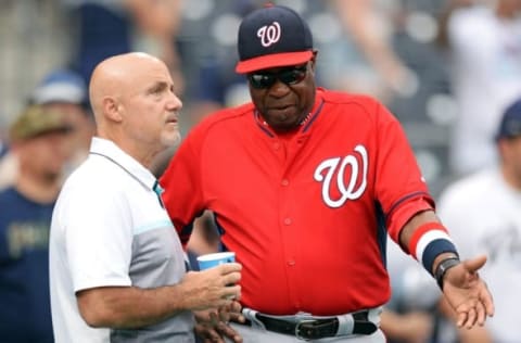 Jun 18, 2016; San Diego, CA, USA; Washington Nationals manager Dusty Baker (R) talks to general manager Mike Rizzo before the game against the San Diego Padres at Petco Park. Mandatory Credit: Jake Roth-USA TODAY Sports