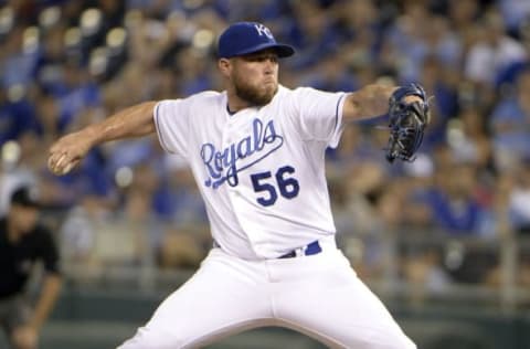 Aug 13, 2015; Kansas City, MO, USA; Kansas City Royals relief pitcher Greg Holland (56) delivers a pitch against the Los Angeles Angels in the ninth inning at Kauffman Stadium. The Angels won the game 7-6. Mandatory Credit: John Rieger-USA TODAY Sports