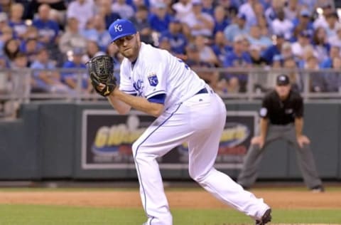 Sep 3, 2016; Kansas City, MO, USA; Kansas City Royals relief pitcher Wade Davis (17) checks a runner at first in the ninth inning against the Detroit Tigers at Kauffman Stadium. The Royals won 5-2. Mandatory Credit: Denny Medley-USA TODAY Sports