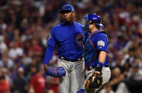 Nov 2, 2016; Cleveland, OH, USA; Chicago Cubs relief pitcher Aroldis Chapman (left) talks with catcher Miguel Montero (right) in the 9th inning against the Cleveland Indians in game seven of the 2016 World Series at Progressive Field. Mandatory Credit: Ken Blaze-USA TODAY Sports