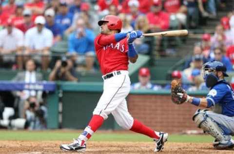 Oct 7, 2016; Arlington, TX, USA; Texas Rangers center fielder Ian Desmond (20) doubles against the Toronto Blue Jays during the seventh inning of game two of the 2016 ALDS playoff baseball series at Globe Life Park in Arlington. Mandatory Credit: Kevin Jairaj-USA TODAY Sports