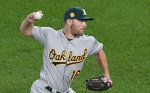 Liam Hendriks #16 of the Oakland Athletics pitches during a baseball game against the Baltimore Orioles at Oriole Park at Camden Yards on September 12, 2018 in Baltimore, Maryland. (Photo by Mitchell Layton/Getty Images)