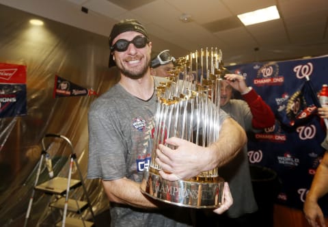 Max Scherzer #31 of the Washington Nationals celebrates in the locker room after defeating the Houston Astros in Game Seven to win the 2019 World Series at Minute Maid Park on October 30, 2019 in Houston, Texas. The Washington Nationals defeated the Houston Astros with a score of 6 to 2. (Photo by Elsa/Getty Images)