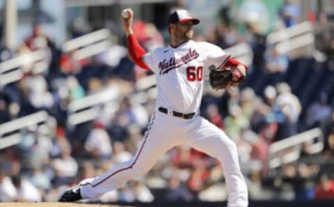 WEST PALM BEACH, FLORIDA – FEBRUARY 23: Hunter Strickland #60 of the Washington Nationals delivers a pitch in the third inning against the Houston Astros of a Grapefruit League spring training game at FITTEAM Ballpark of The Palm Beaches on February 23, 2020 in West Palm Beach, Florida. (Photo by Michael Reaves/Getty Images)