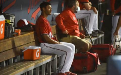 Joe Ross #41 of the Washington Nationals sits in the dugout after a pitching change during the Spring Training game against the New York Mets at The Ballpark of The Palm Beaches on March 13, 2021 in West Palm Beach, Florida. (Photo by Eric Espada/Getty Images)