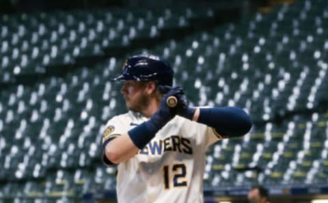 Justin Smoak #12 of the Milwaukee Brewers bats in the second inning against the Cincinnati Reds at Miller Park on August 25, 2020 in Milwaukee, Wisconsin. (Photo by Dylan Buell/Getty Images)