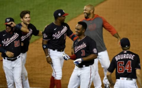 Michael A. Taylor #3 of the Washington Nationals celebrates with teammates after driving in the game winning run with a single in the 12th inning against the Atlanta Braves at Nationals Park on September 11, 2020 in Washington, DC. (Photo by G Fiume/Getty Images)