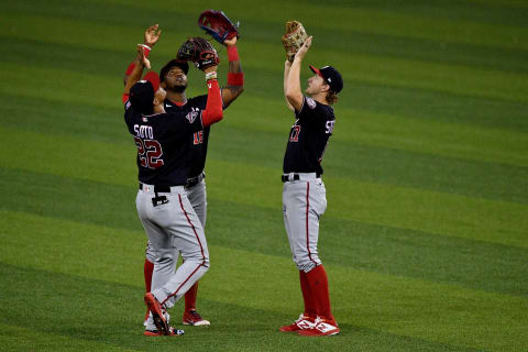 Juan Soto #22, Victor Robles #16, and Andrew Stevenson #17 of the Washington Nationals celebrate the winning against the Miami Marlins by score of 5-0 at Marlins Park on September 18, 2020 in Miami, Florida. (Photo by Mark Brown/Getty Images)