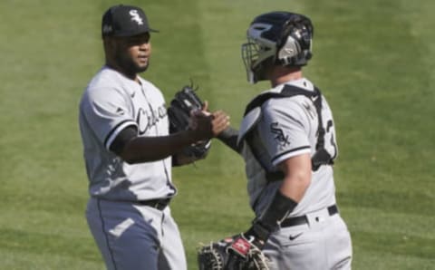 Alex Colome #48 and James McCann #33 of the Chicago White Sox celebrates after they defeated the Oakland Athletics 4-1 in the Wild Card Round Game One at RingCentral Coliseum on September 29, 2020 in Oakland, California. (Photo by Thearon W. Henderson/Getty Images)