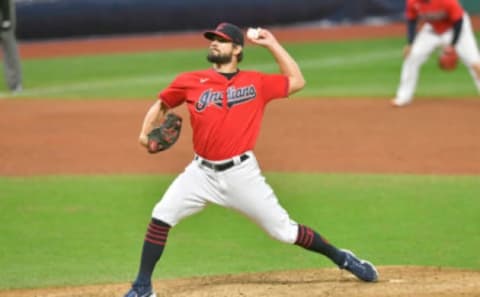 Closing pitcher Brad Hand #33 of the Cleveland Indians pitches during the ninth inning of Game Two of the American League Wild Card Series against the New York Yankees at Progressive Field on September 30, 2020 in Cleveland, Ohio. The Yankees defeated the Indians 10-9. (Photo by Jason Miller/Getty Images)