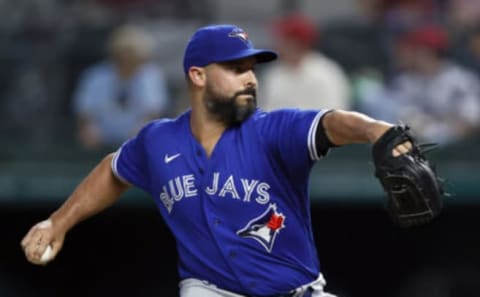 Tanner Roark #14 of the Toronto Blue Jays pitches against the Texas Rangers in the bottom of the first inning at Globe Life Field on April 06, 2021 in Arlington, Texas. (Photo by Tom Pennington/Getty Images)