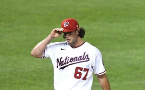 Kyle Finnegan #67 of the Washington Nationals walks to the dug out during a baseball game against the Toronto Blue Jays at Nationals Park on August 17, 2021 in Washington, DC. (Photo by Mitchell Layton/Getty Images)