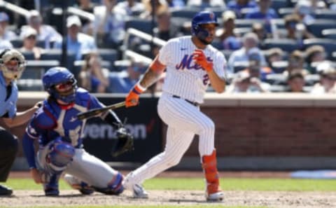 NEW YORK, NEW YORK – JULY 03: Dominic Smith #2 of the New York Mets in action against the Texas Rangers at Citi Field on July 03, 2022 in New York City. The Mets defeated the Rangers 4-1. (Photo by Jim McIsaac/Getty Images)