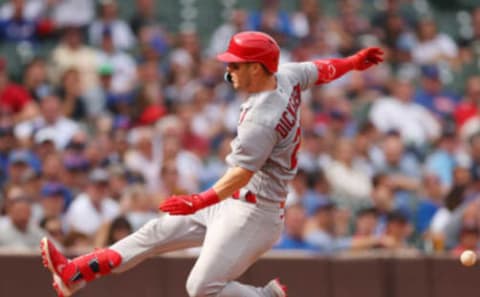 CHICAGO, ILLINOIS – AUGUST 25: Corey Dickerson #25 of the St. Louis Cardinals safely slides into third base after hitting a triple against the Chicago Cubs during the eighth inning at Wrigley Field on August 25, 2022 in Chicago, Illinois. (Photo by Michael Reaves/Getty Images)