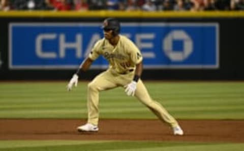 PHOENIX, ARIZONA – SEPTEMBER 16: Stone Garrett #46 of the Arizona Diamondbacks gets a lead from second base against the San Diego Padres at Chase Field on September 16, 2022 in Phoenix, Arizona. (Photo by Norm Hall/Getty Images)