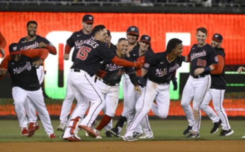 WASHINGTON, DC – SEPTEMBER 28: CJ Abrams #5 of the Washington Nationals celebrates with teammates after driving in the game winning run with a single in the tenth inning against the Atlanta Braves at Nationals Park on September 28, 2022 in Washington, DC. (Photo by Greg Fiume/Getty Images)