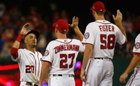 Ian Desmond #20 of the Washington Nationals celebrates with teammates Jordan Zimmermann #27 and Doug Fister #58 following the Nationals 7-2 win over the New York Mets at Nationals Park on July 20, 2015 in Washington, DC. (Photo by Rob Carr/Getty Images)