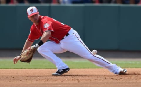 Tyler Moore #32 of the Washington Nationals dives for a ground ball during the second inning of a spring training game against the New York Mets at Space Coast Stadium on March 11, 2016 in Viera, Florida. (Photo by Stacy Revere/Getty Images)