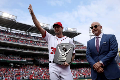 The 2016 National League Cy Young Award is presented to Max Scherzer #32 of the Washington Nationals before the start of the Opening Day game against the Miami Marlins on April 3, 2017 at Nationals Park in Washington, DC. The Nationals won 4-2. Also pictured is Nationals General Manager Mike Rizzo (R). (Photo by Win McNamee/Getty Images)