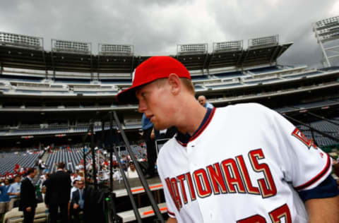 WASHINGTON – AUGUST 21ST: Stephen Strasburg, the overall first pick in the 2009 Major League Baseball draft, departs a press conference where he was introduced at Nationals Park August 21st, 2009 in Washington, DC. Strasburg, a right handed pitcher from San Diego State University, was signed by the Nationals earlier this week wth a record contract for an amateur player. (Photo by Win McNamee/Getty Images)