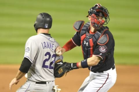 WASHINGTON, DC – APRIL 12: Matt Wieters #32 of the Washington Nationals tags out Chris Iannetta #22 of the Colorado Rockies who tried to score on Ian Desmond #20 (not pictured) ground ball in the fifth inning during a baseball game at Nationals Park on April 12, 2018 in Washington, DC. (Photo by Mitchell Layton/Getty Images)