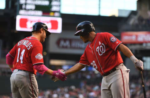 PHOENIX, AZ – MAY 13: Mark Reynolds #14 of the Washington Nationals is congratulated by Pedro Severino #29 after hitting a solo home run in the sixth inning of the MLB game against the Arizona Diamondbacks at Chase Field on May 13th in Phoenix, Arizona. (Photo by Jennifer Stewart/Getty Images)